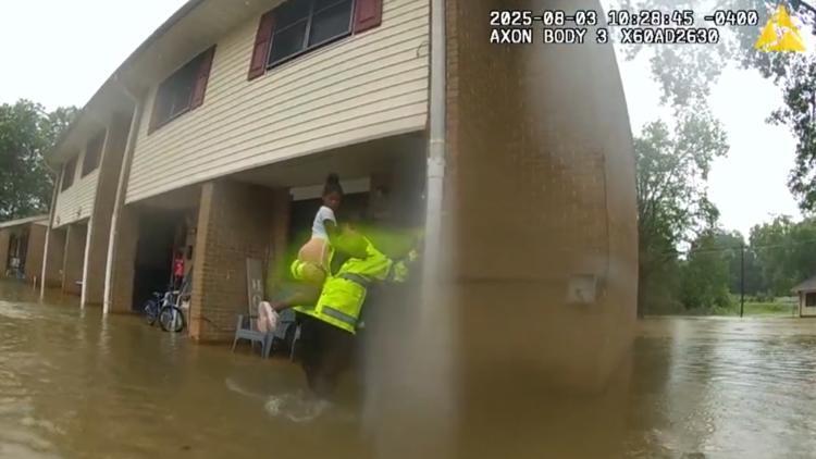 First responders carry residents to safety amid flooding at Covington apartment complex