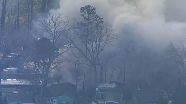Fire crews in Gwinnett County battle flames at mobile home park