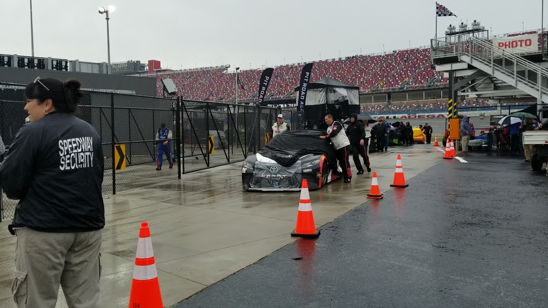 A very slow procession of cars to the garage as the race is called for rain. Race will be resumed on Monday, Oct. 14 at 1:00 p.m. CST.