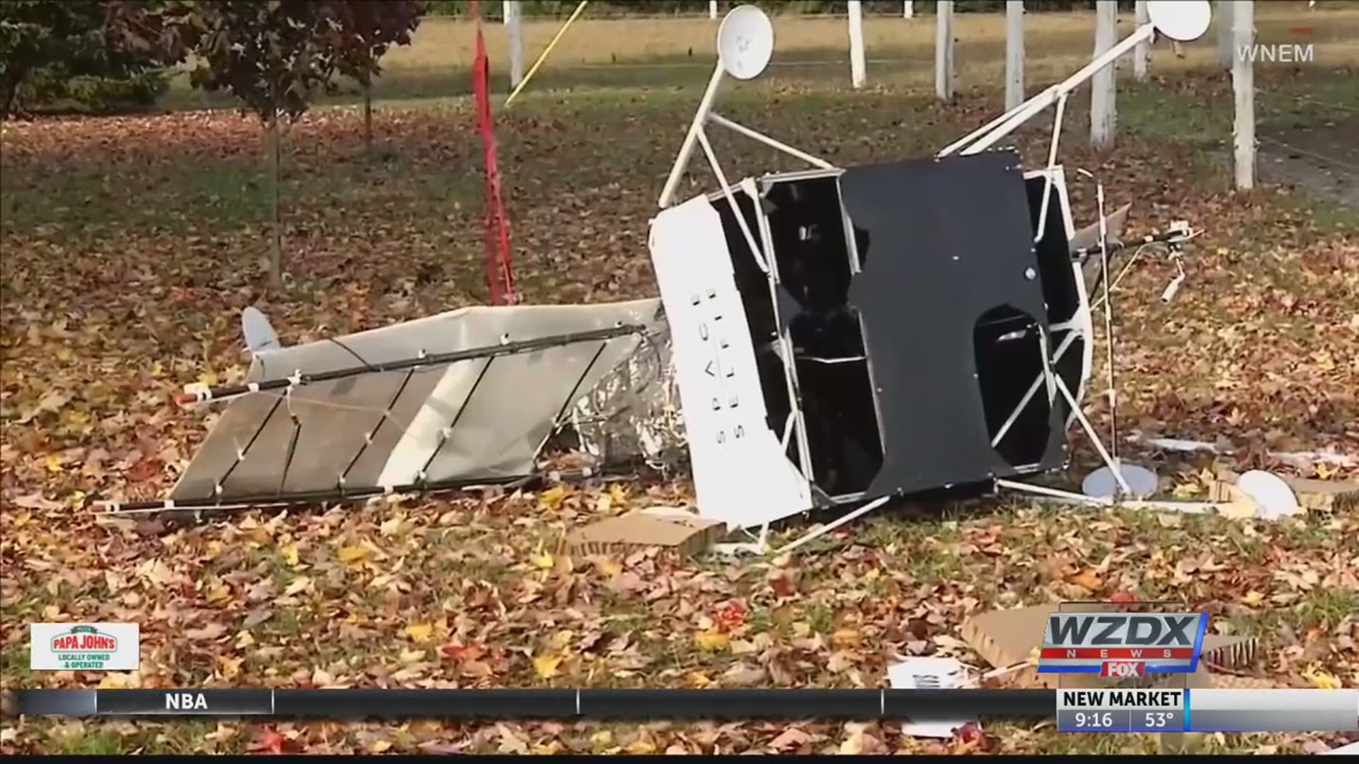 That's not a Halloween prop - that's an actual satellite that crashed onto someone's front lawn.