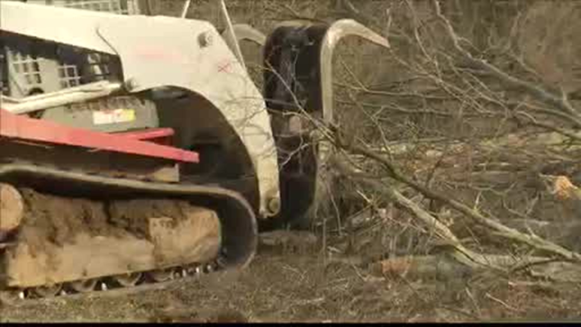 Neighbors around the Brindlee Mountain Primary School in Union Grove are cleaning up damage from Saturday's tornado.