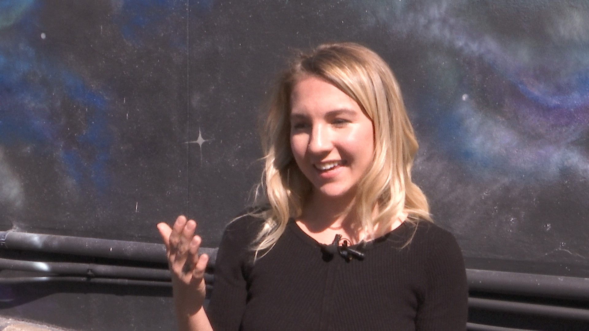 Artist Jessie Andrews says the wind caused her problems when painting the mural, but it also added to the piece.