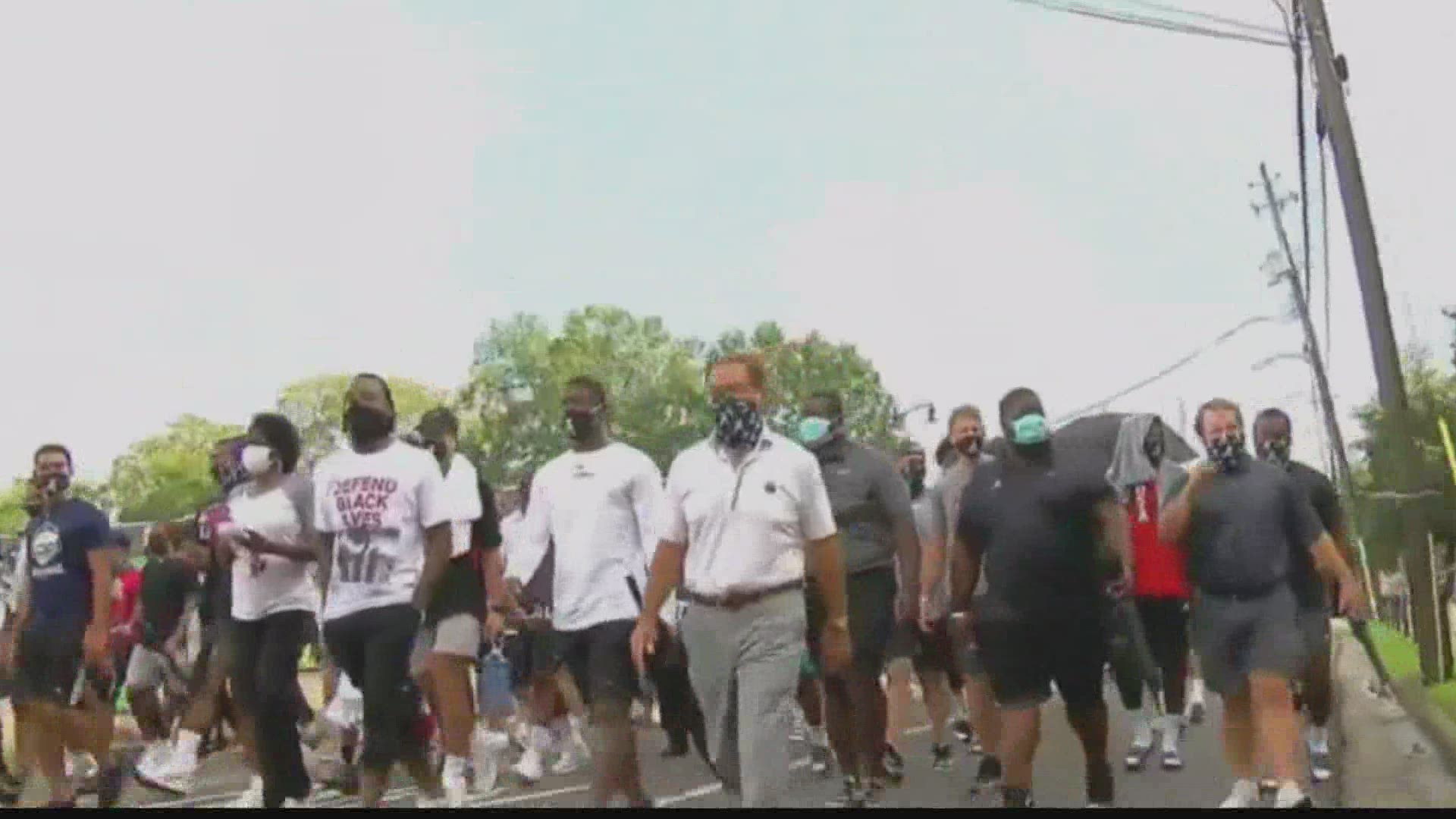 Nick Saban led dozens of his football players and other athletes on a march to protest social injustice and recent incidents of police brutality against Black men a