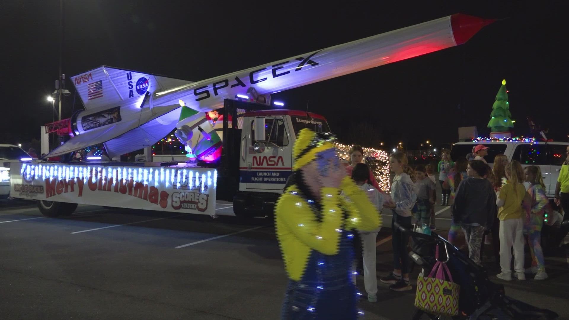 Local children's theatre group, diverse marching krewe and Elvis impersonator, and more attend this year's Huntsville Christmas Parade.