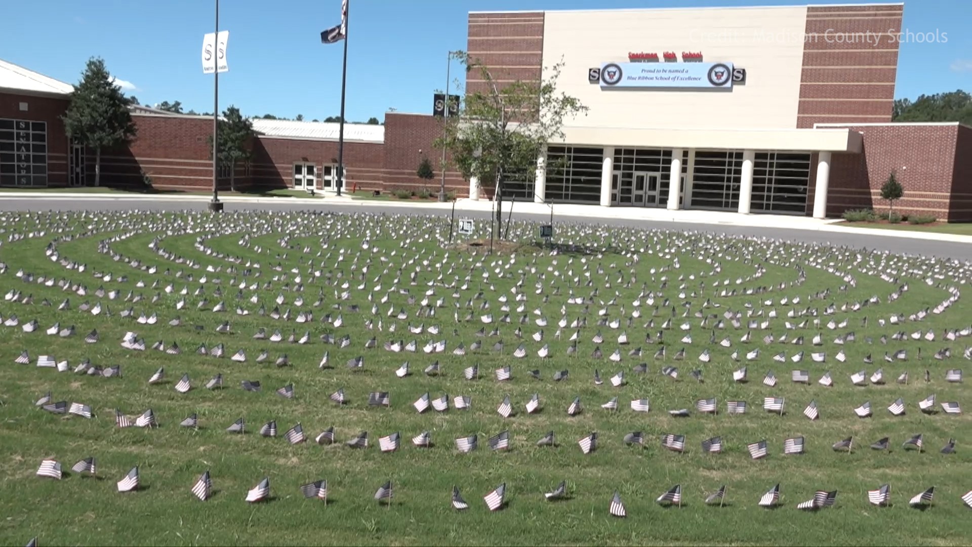 Sparkman High School students set out nearly 3,000 flags, one at a time, to honor the victims of 9/11.