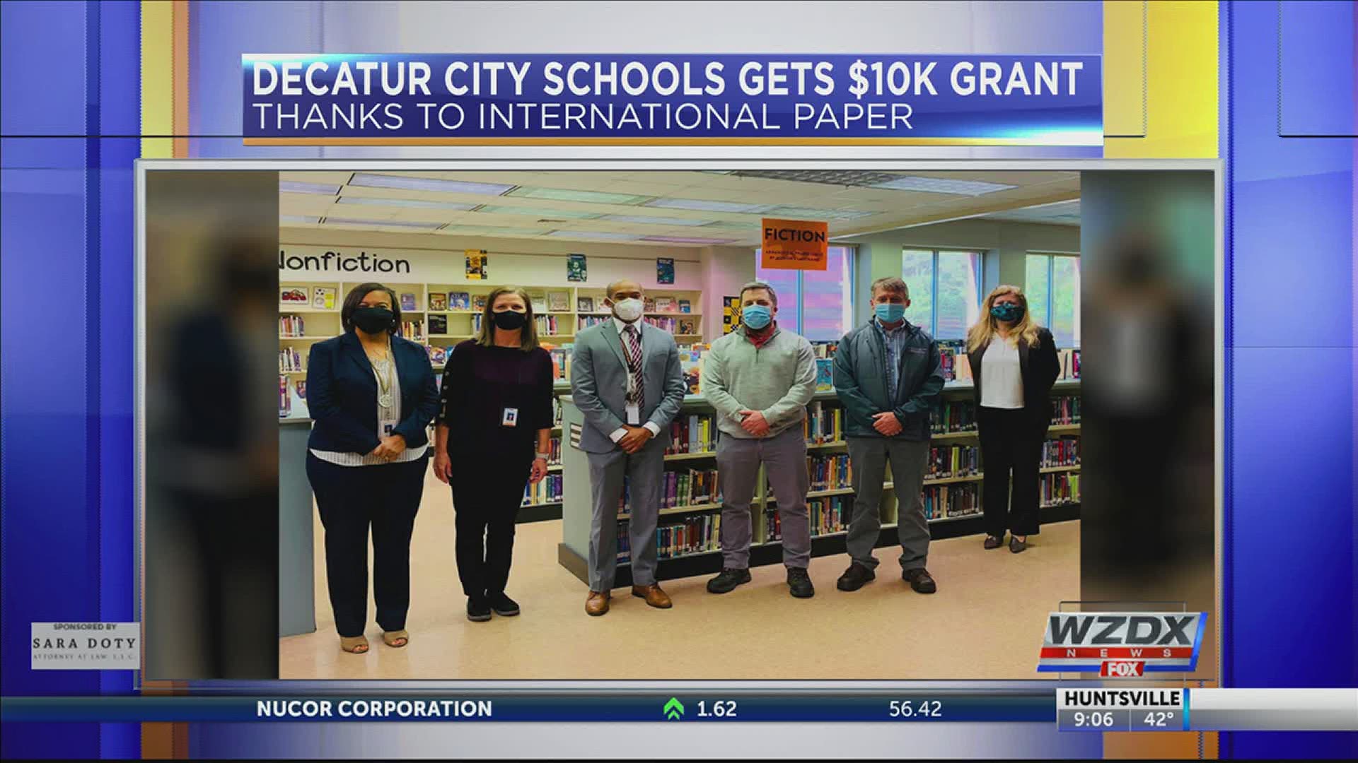 The $10,000 grant from International Paper will help expand e-book offerings for more than 6,100 students.