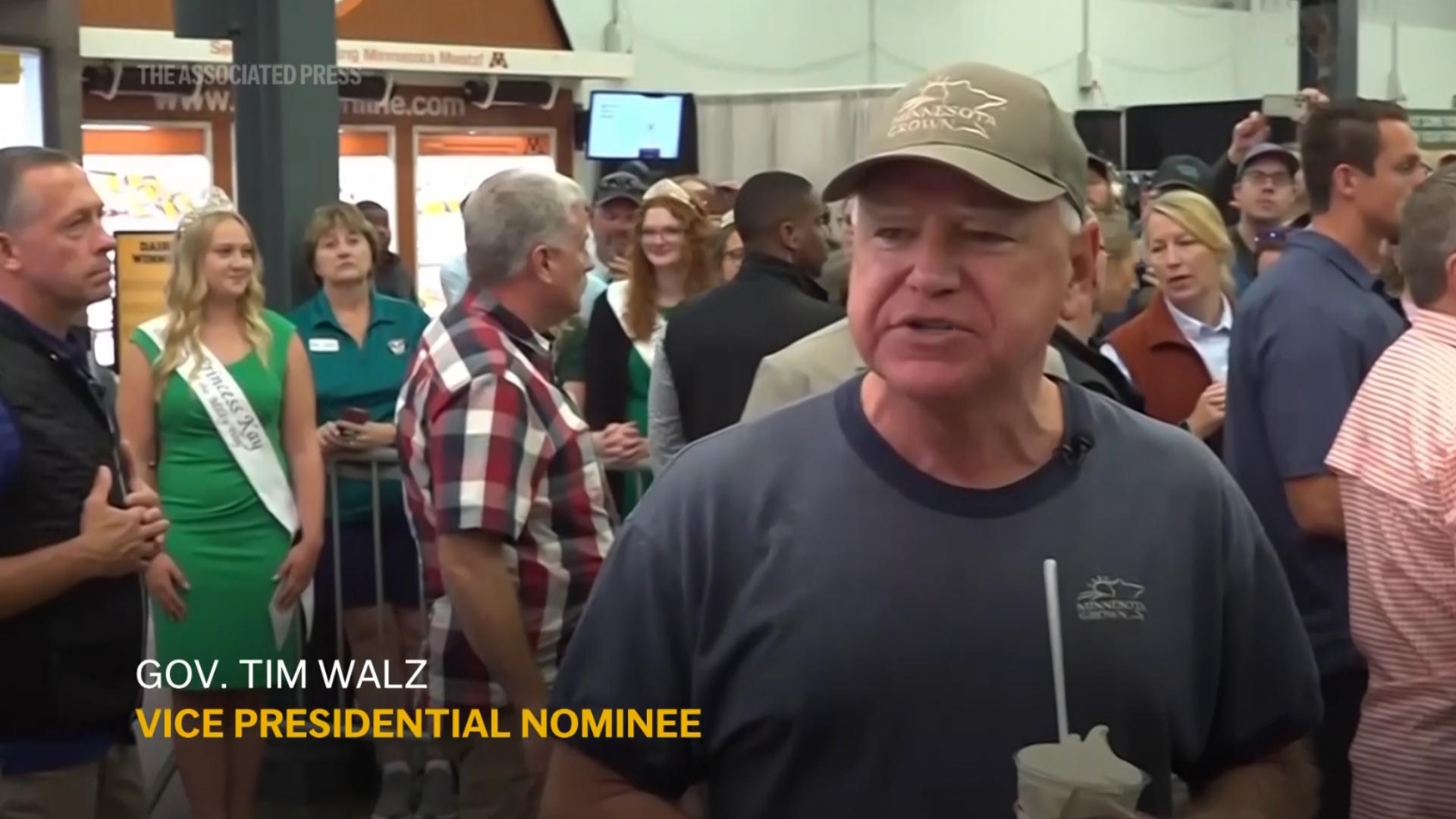 Democratic vice presidential nominee Tim Walz munched on a pork chop on a stick and washed it down with a vanilla shake with his family at the Minnesota State Fair.