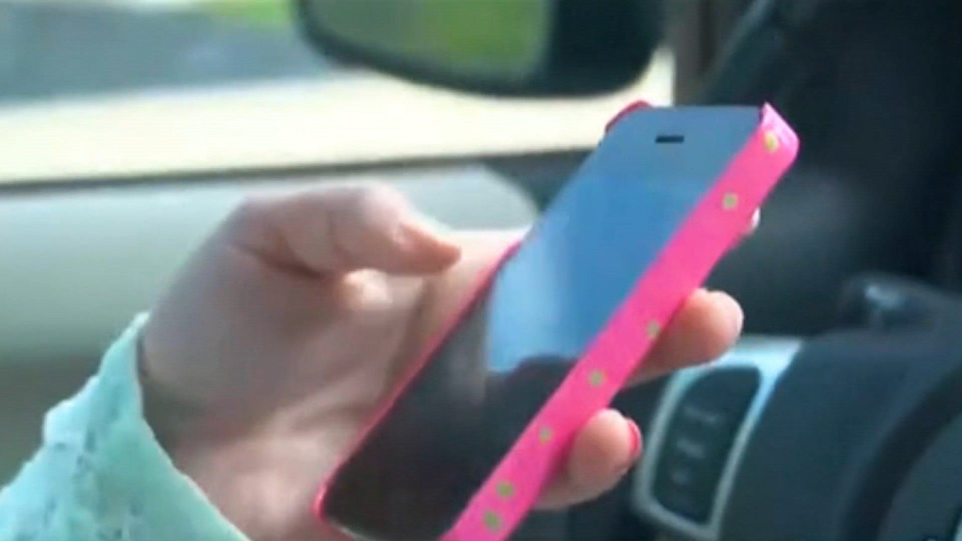 A newly-signed Alabama state law makes it illegal to hold a mobile device while operating a vehicle.