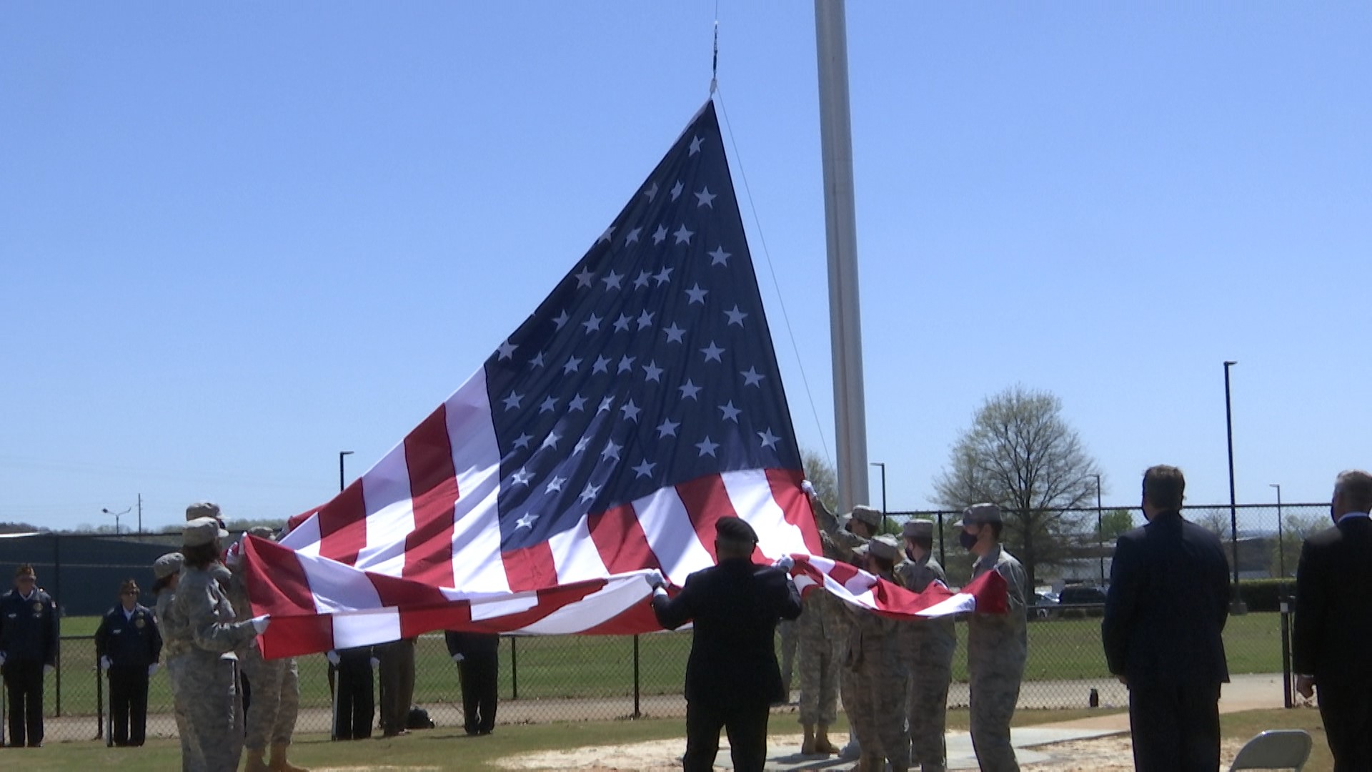 Madison City Schools held a dedication ceremony and christening of its new flagpole. It flies 60 feet high, at the Madison City Stadium.
