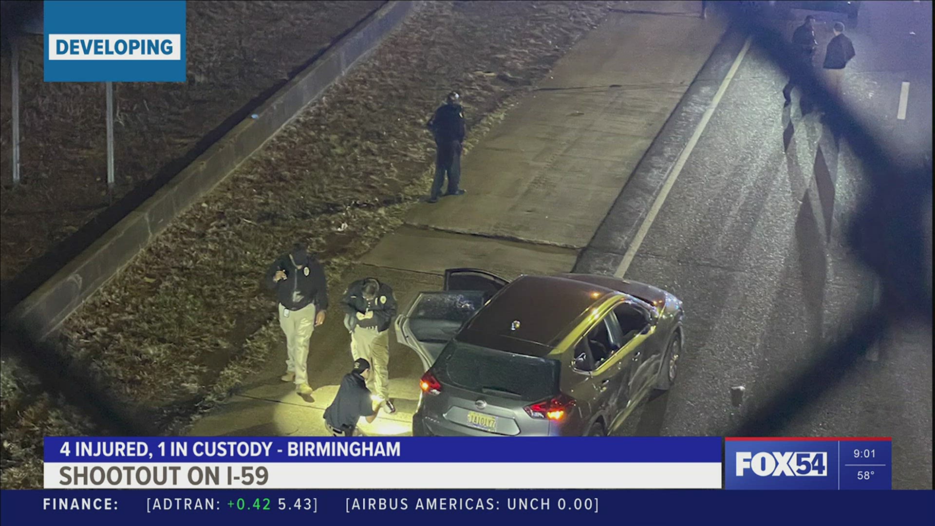 (Photos courtesy WBRC) - A confrontation over a stolen car led to gunfire on the road, Birmingham Police said.