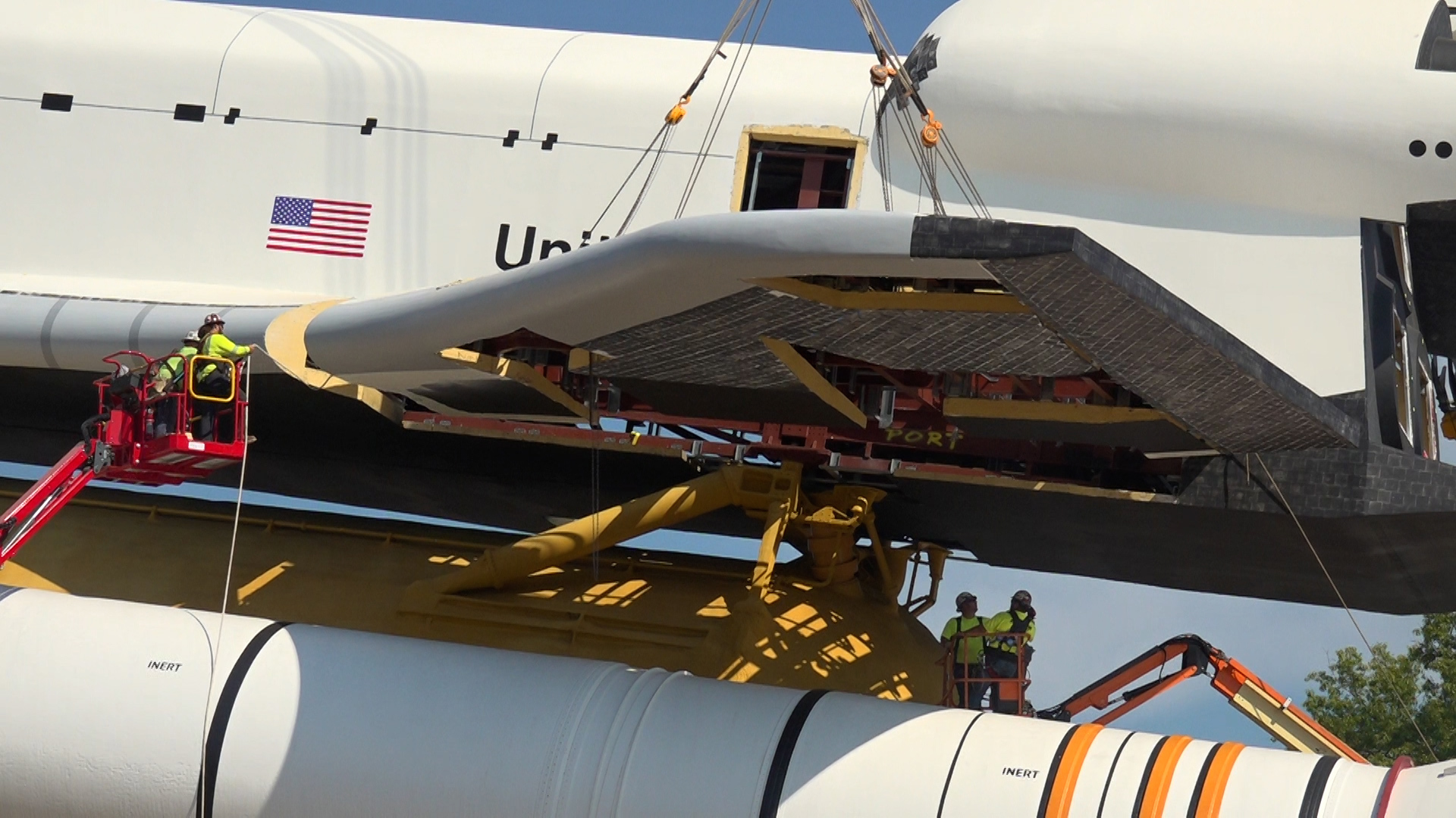 On Thursday, crews made more progress by reattaching the wings to the orbiter's body. This step is crucial in restoring Pathfinder to its full, iconic form.