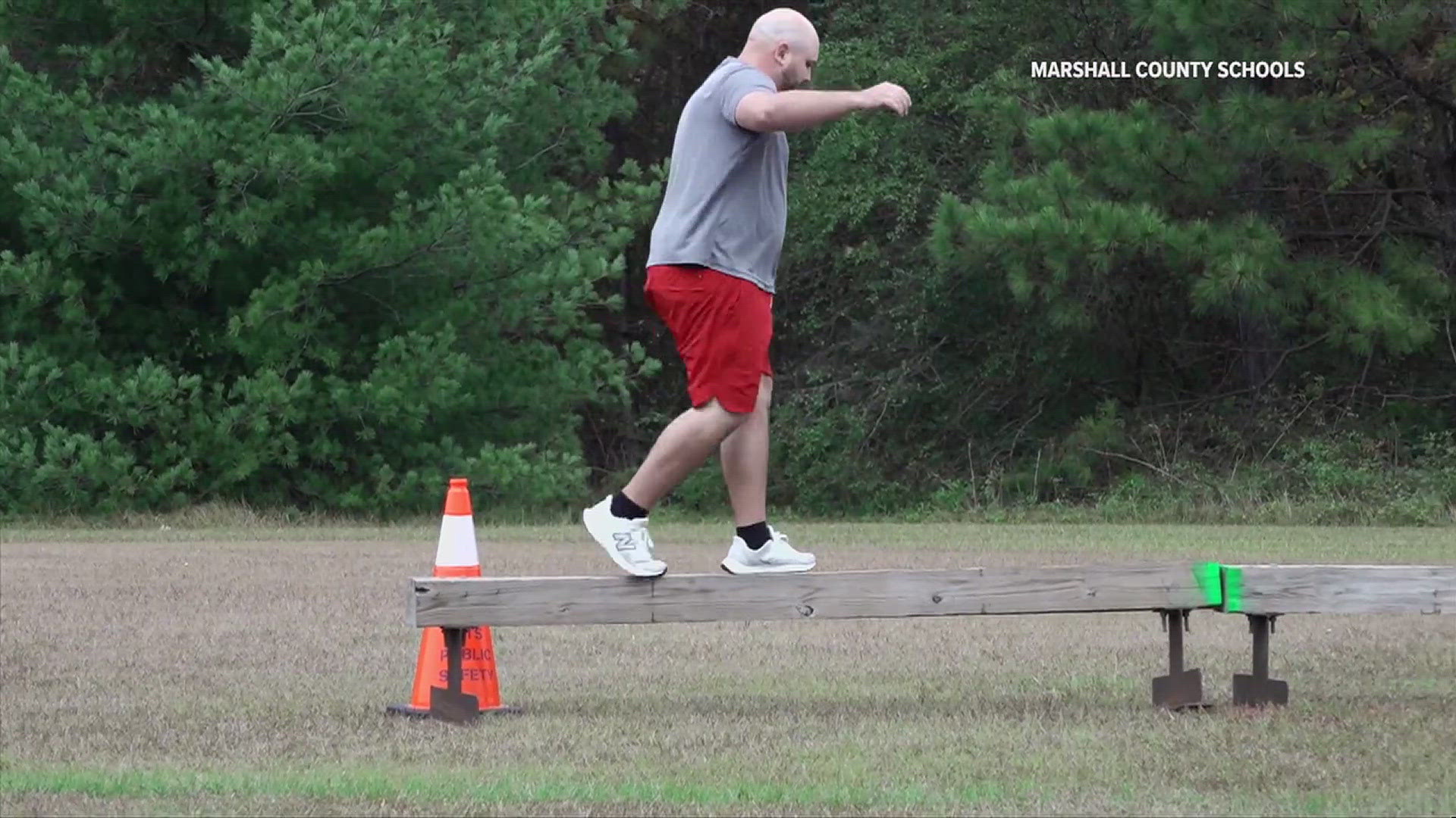 Marshall Technical School students watched as potential recruits ran an obstacle course on campus.