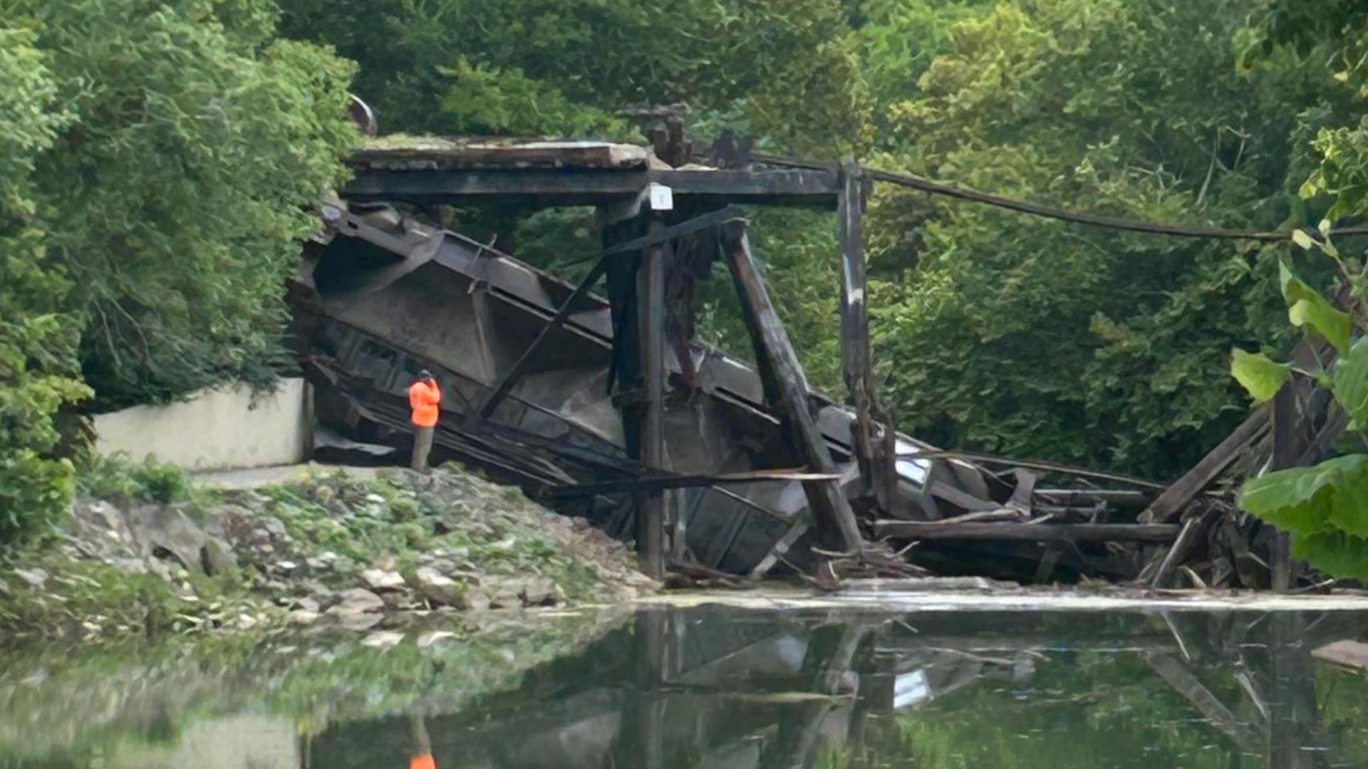 Train trestle failed while a train was on it.