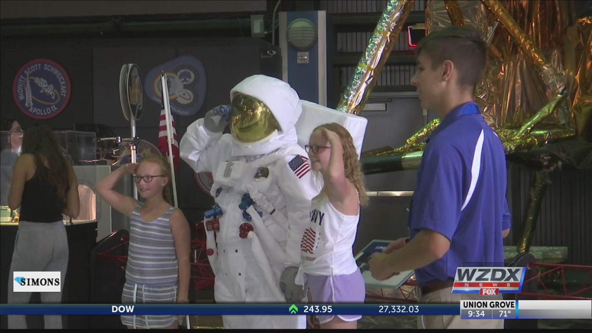 Visitors to the U.S. Space and Rocket Center take a look back on the impact of the Apollo 11 flight.