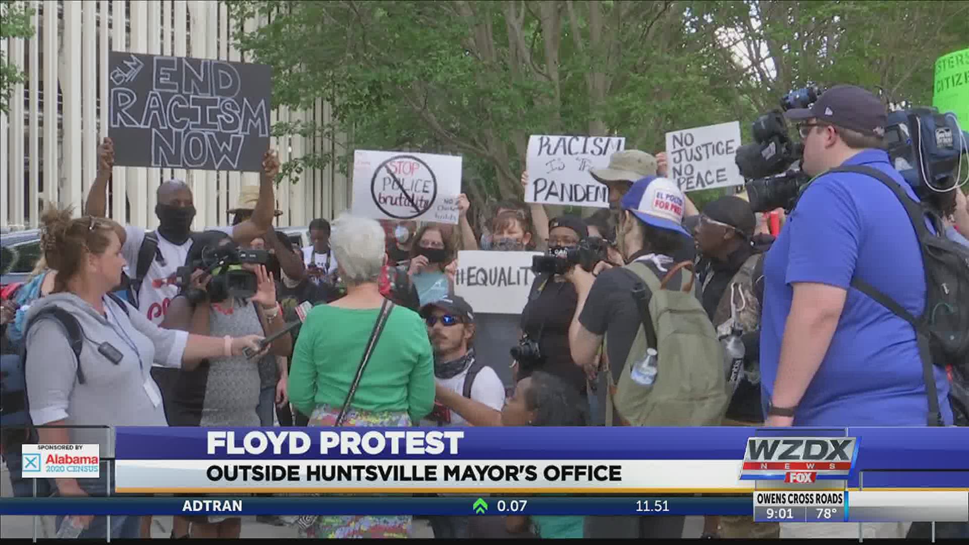 Protesters gathered outside City Hall to make their voices heard and ask for change.