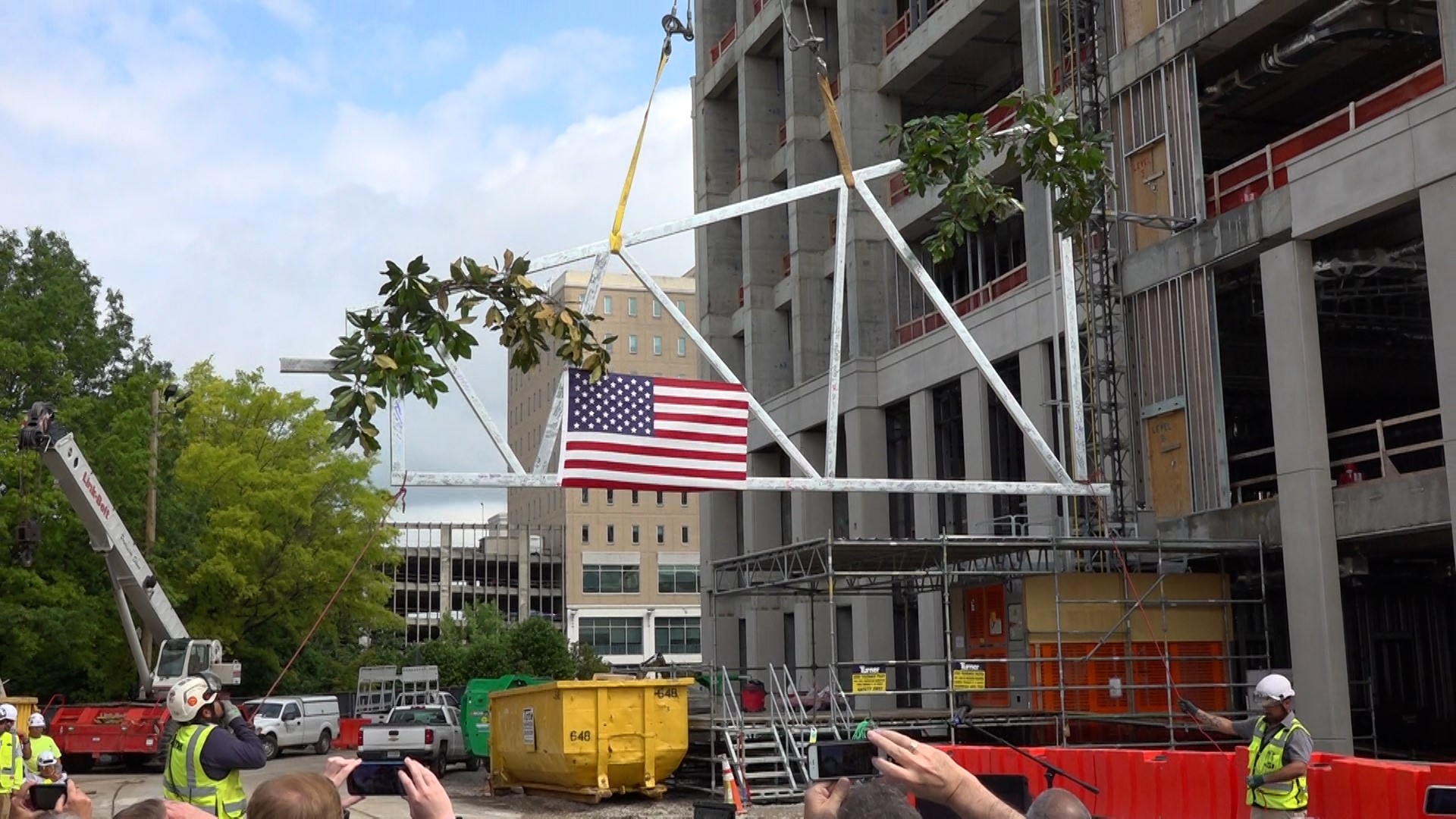 Huntsville's new city hall is heading for completion and a "topping ceremony" was one more step in that direction.