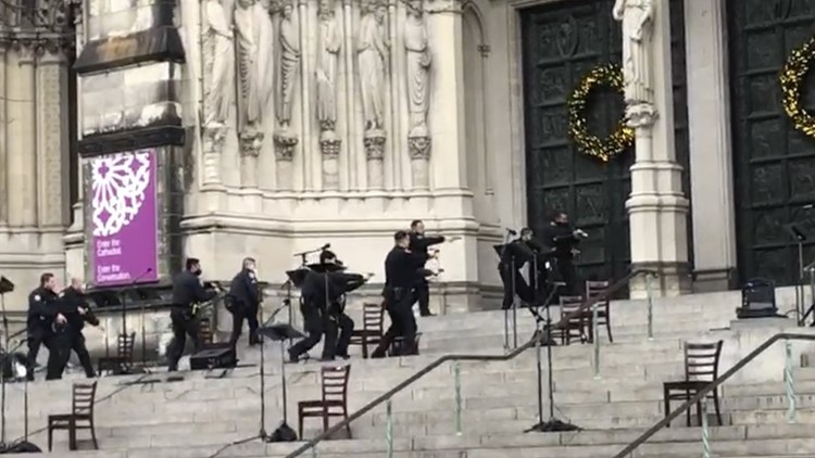 Gunman shot by police at New York City cathedral Christmas concert Gunman shot by police at New York City cathedral Christmas concert